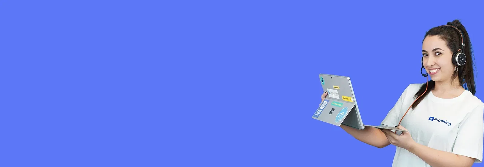 lingoking employee with headset and tablet