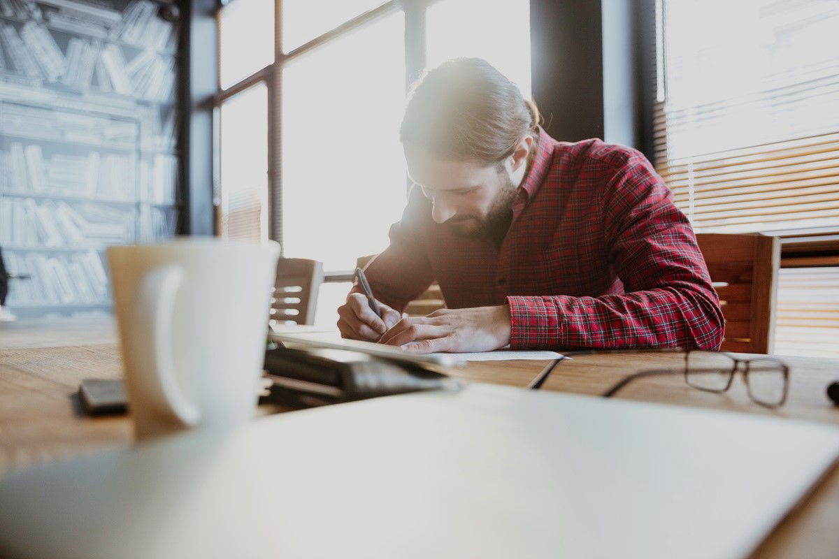 Man sitting at the desk working in Norway