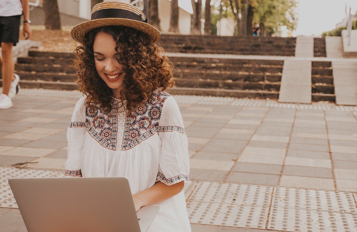 Woman working in Portugal at her laptop