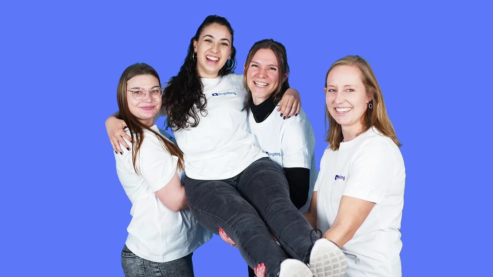 lingoking customer support team holding up one of the team members