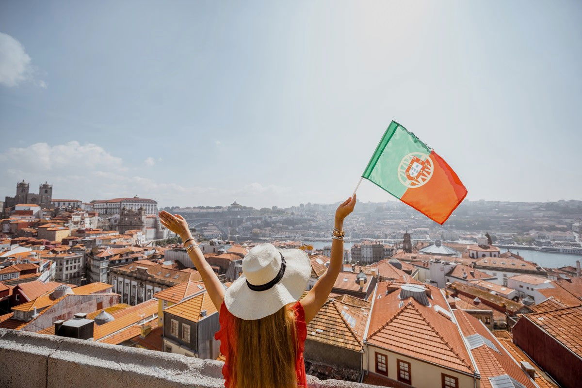Woman waving Portuguese flag