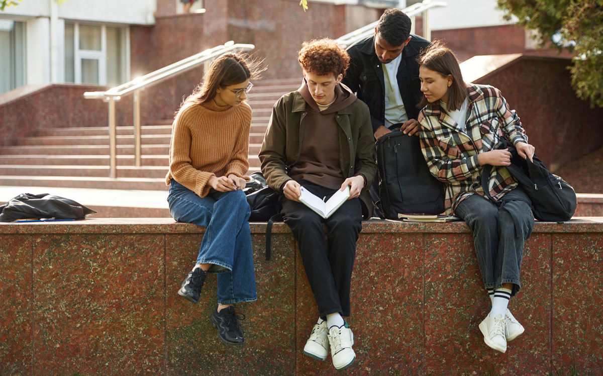 Young people sitting on campus studying in Canada