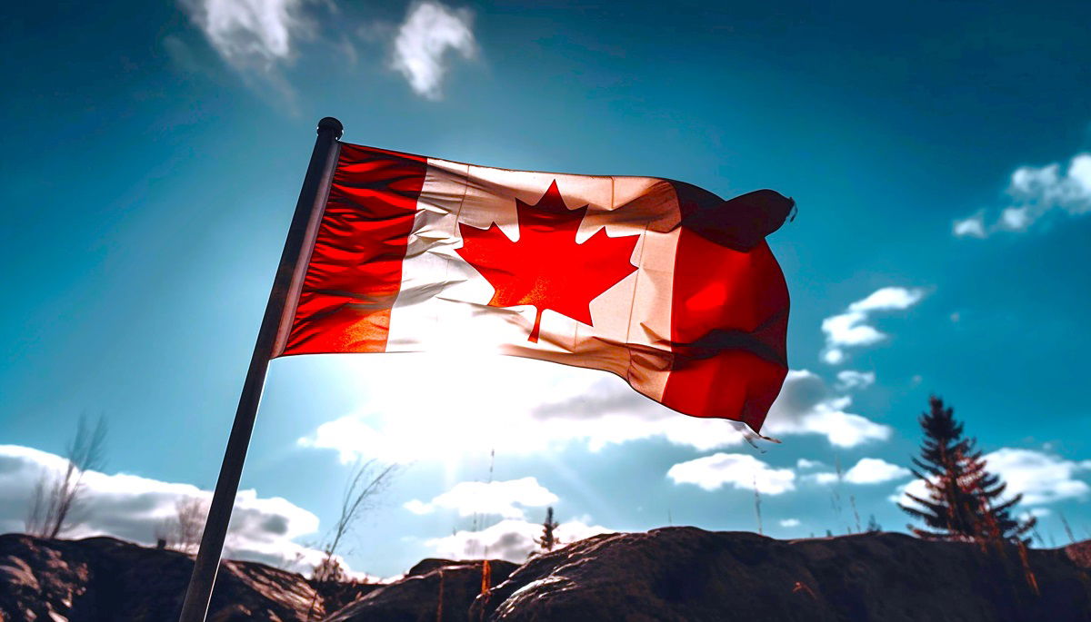 Canadian flag over the mountains with a bright blue sky