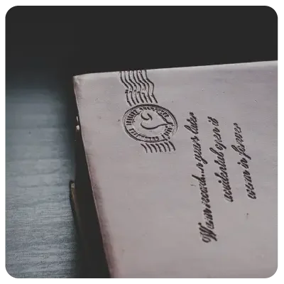 View of the address field of a brown envelope with postmark.