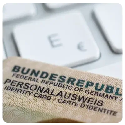 Close-up of an identity card in front of a keyboard.