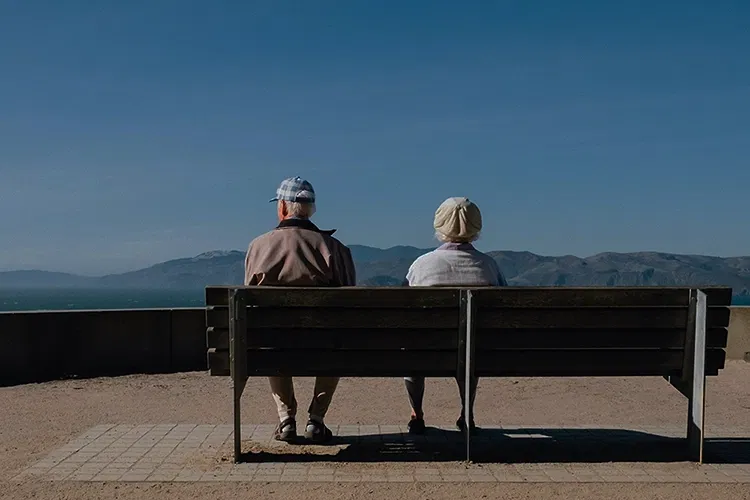 Old couple sitting on a bench