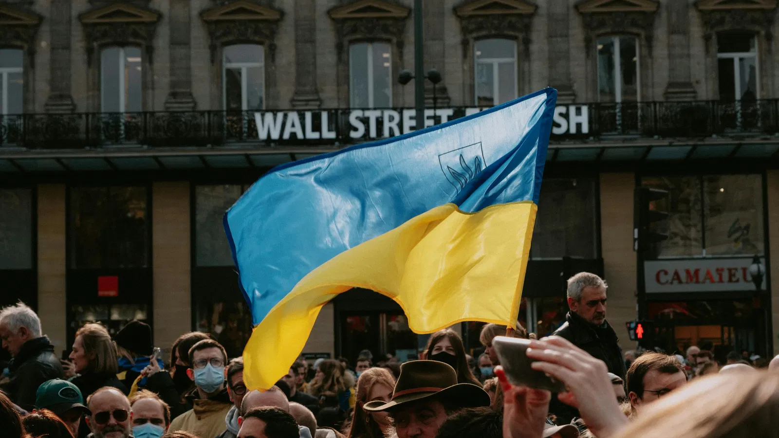 Ukrainian flag waving over a crowd