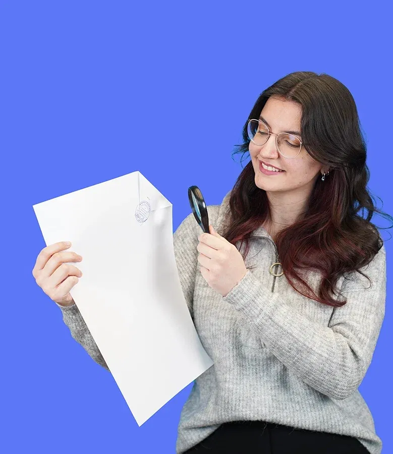 lingoking employee with a certified translation in her hands looking on it with magnifying glass