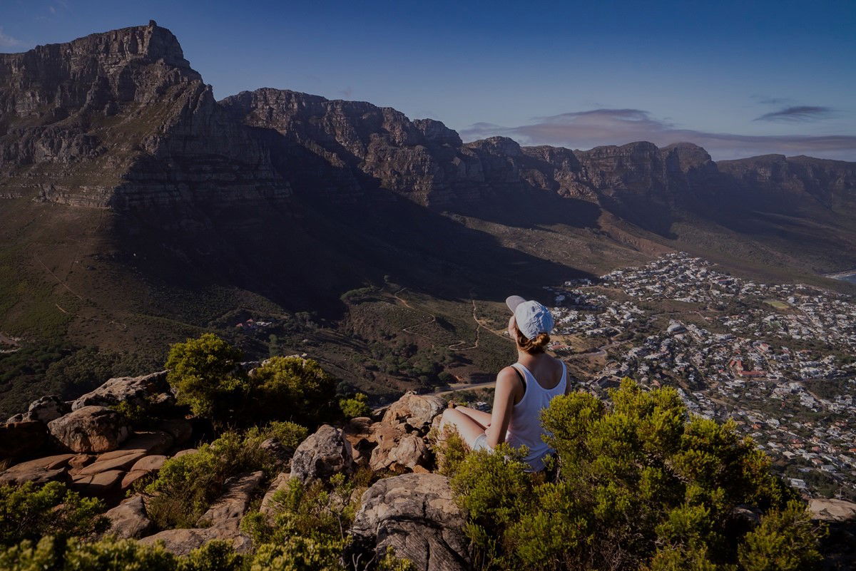 Woman on mountain overlooking cape town