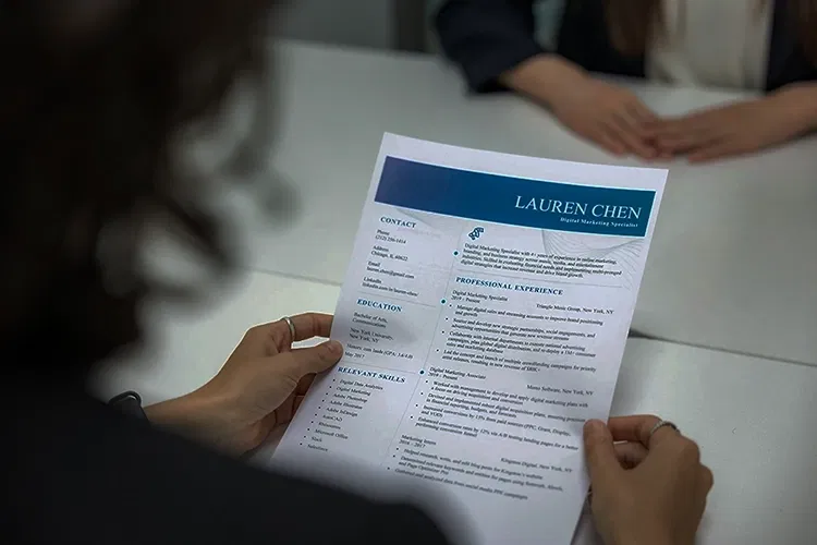 Someone holding a CV