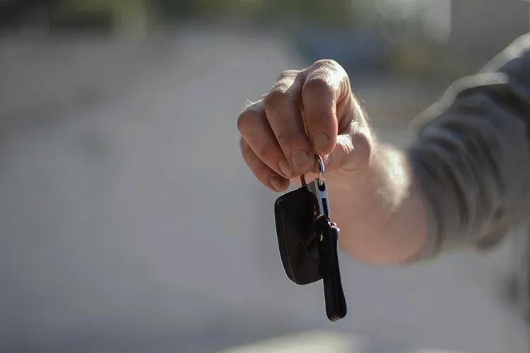 Someone holding car keys