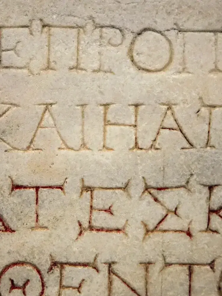 Greek letters on a stone plaque