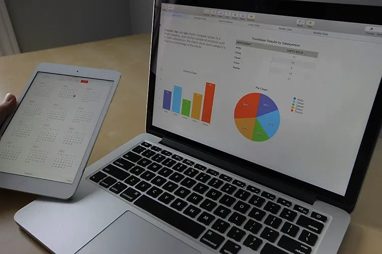 Laptop and smartphone shwoing statistics