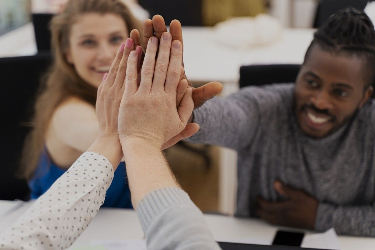 People putting their hands together
