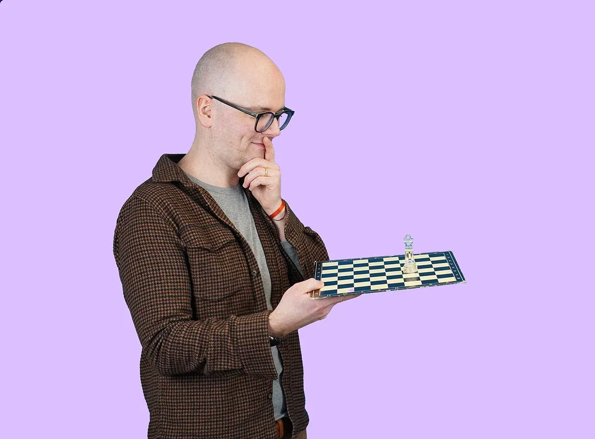 lingoking employee looking at a chess board and thinking