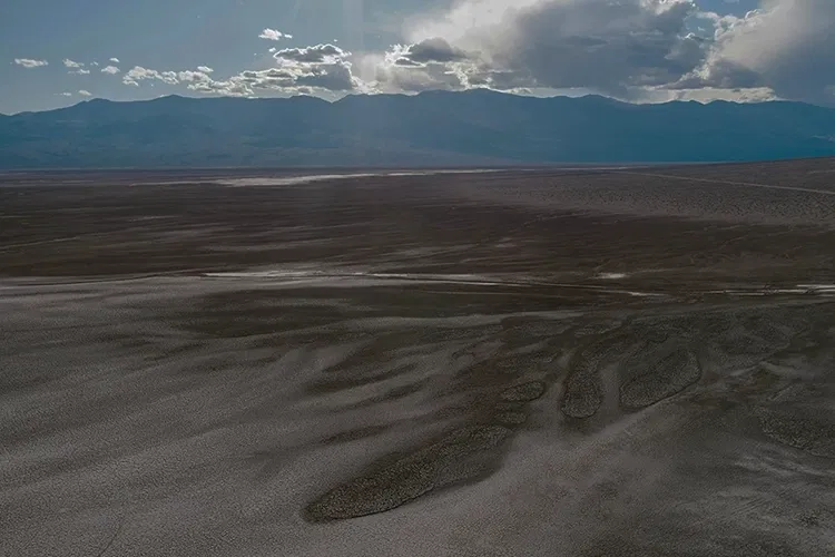 Desert with mountains in the background
