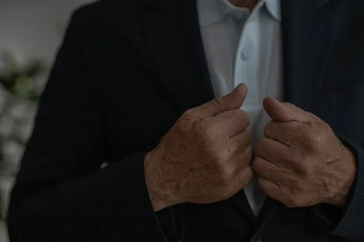 Man straightening his suit