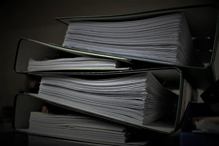 Pile of folders full of paper