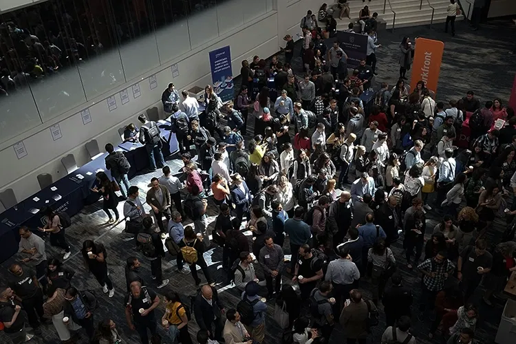 Mass of people standing in a hall