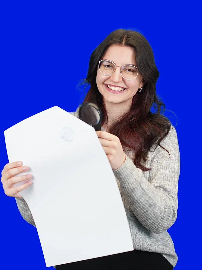 lingoking employee holding a certified translation and holding a magnifying glass